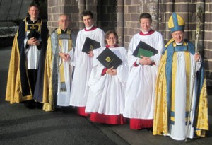 Fr Harri (right) with the Dean of St David's, Choral Scholars and the Bishop of St David's